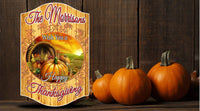 Personalized Thanksgiving sign with cornucopia, pumpkins, autumn sunset, faux wood plank background, and editable text.