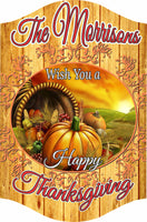 Personalized Thanksgiving sign with cornucopia, pumpkins, autumn sunset, faux wood plank background, and editable text.