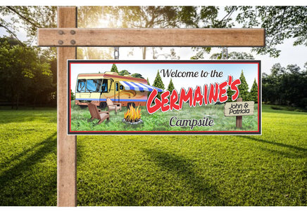 Personalized RV camping welcome sign featuring distant pine trees, a crackling campfire surrounded by wooden chairs, and a custom name. All lines of text are editable.