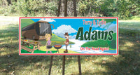 Personalized RV sign featuring a fisherman and his wife barbecuing near a river. All lines of text are editable, including family name, first names, and a tagline.