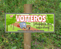 Personalized sign featuring a red pickup truck towing a 5th wheel and a dog house with the caption "Wherever We Roam, We Are Home." All lines of text are editable, including family name, first names, and pets' names.
