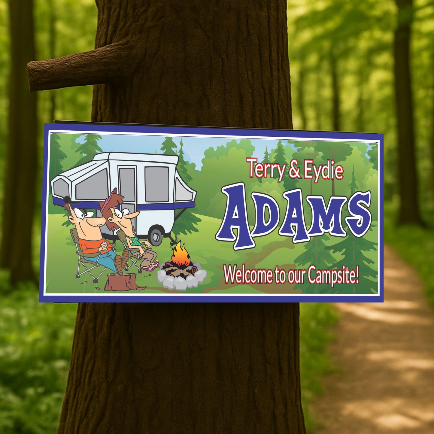 Custom camping sign mounted on a tree in a wooded campsite