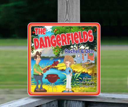 Personalized RV sign with a cartoonish couple grilling at a campsite, featuring editable text