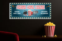 Custom home cinema sign displayed above seating in a dark movie room setting