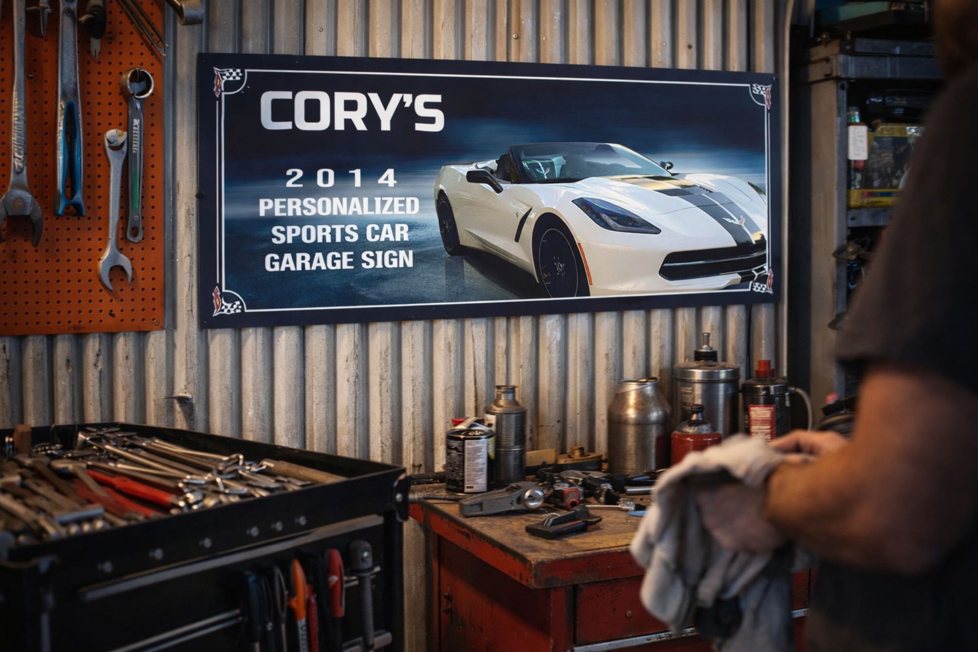 Custom sports car garage sign displayed on workshop wall above tool bench