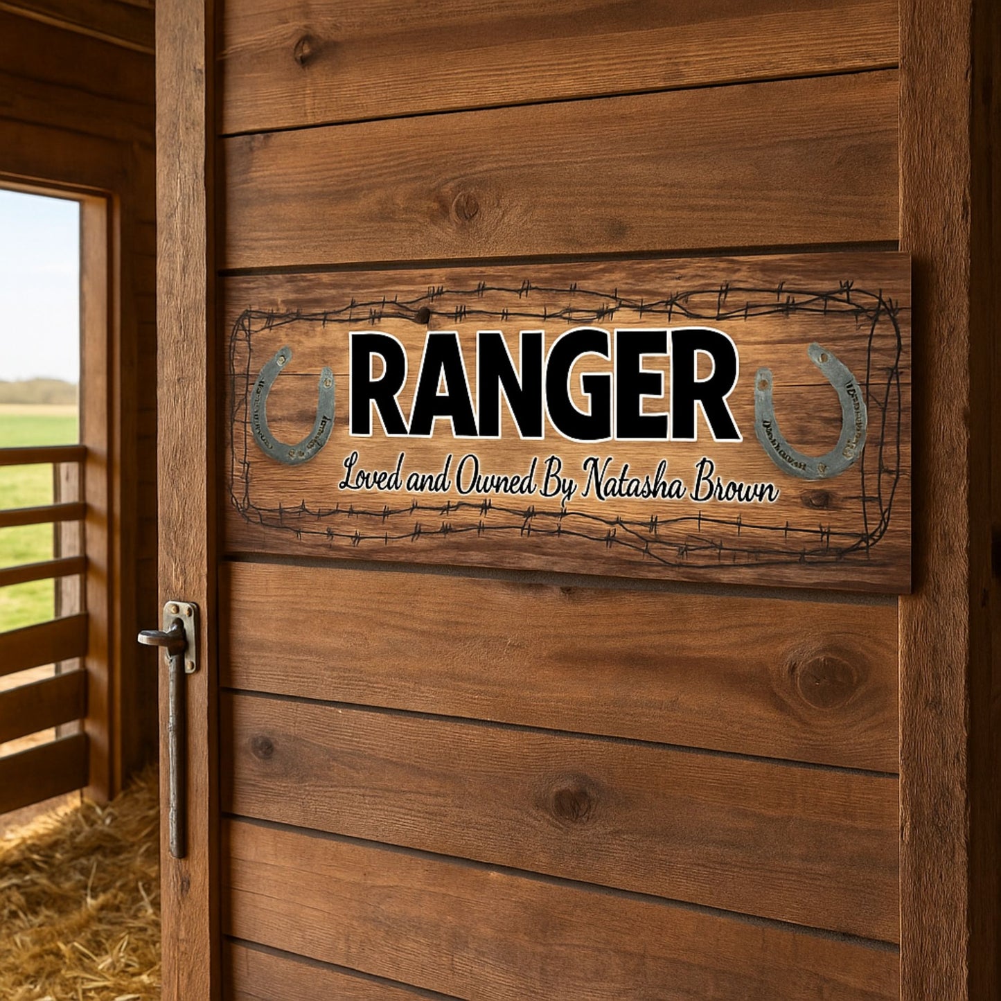 Horse name sign displayed on wooden barn door