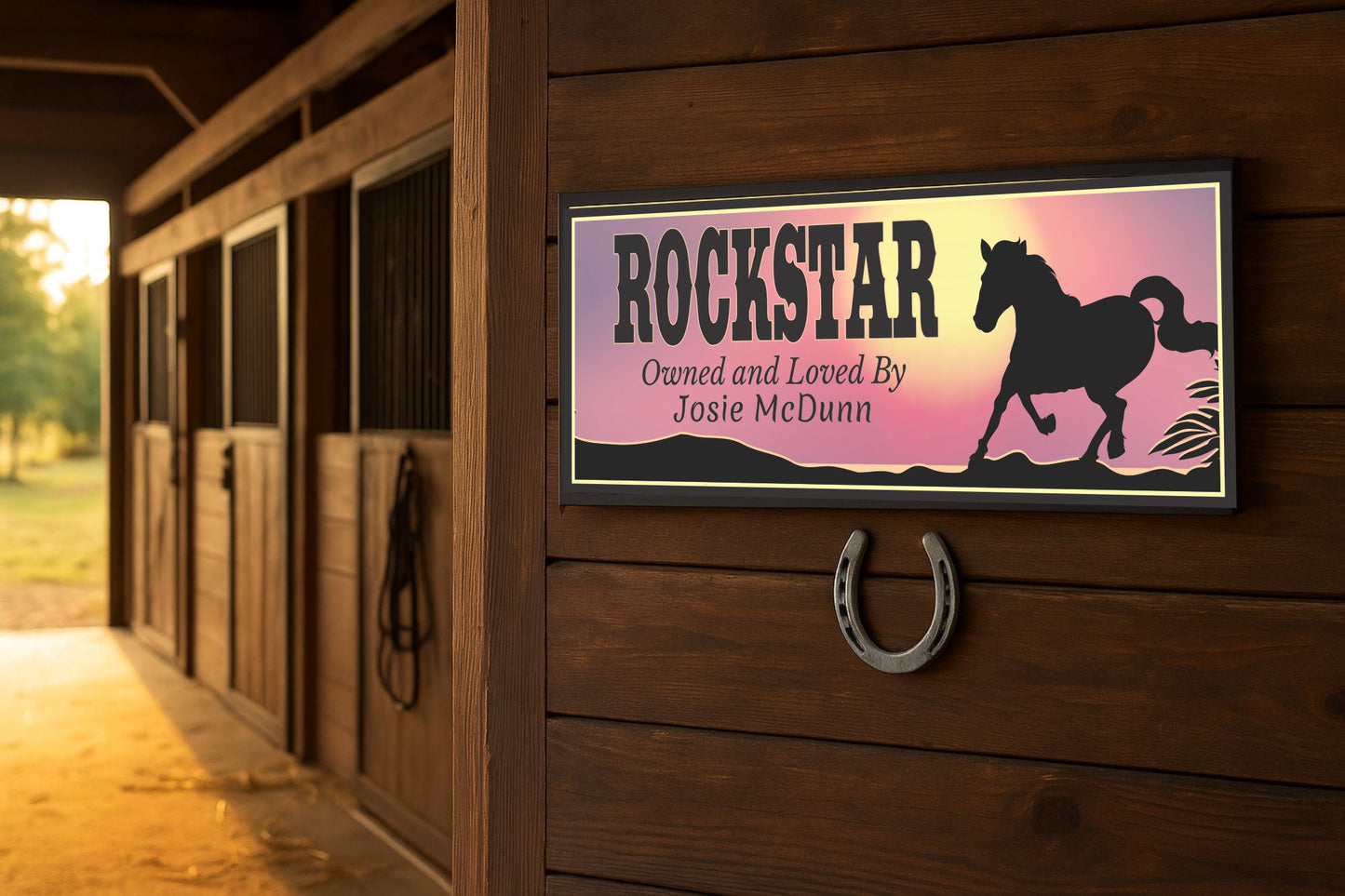 Custom barn sign mounted on a wooden stable door