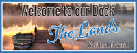 Personalized lake dock sign featuring a rowboat and dock photographic background with editable text. Perfect for adding a personal touch to your lakefront property.