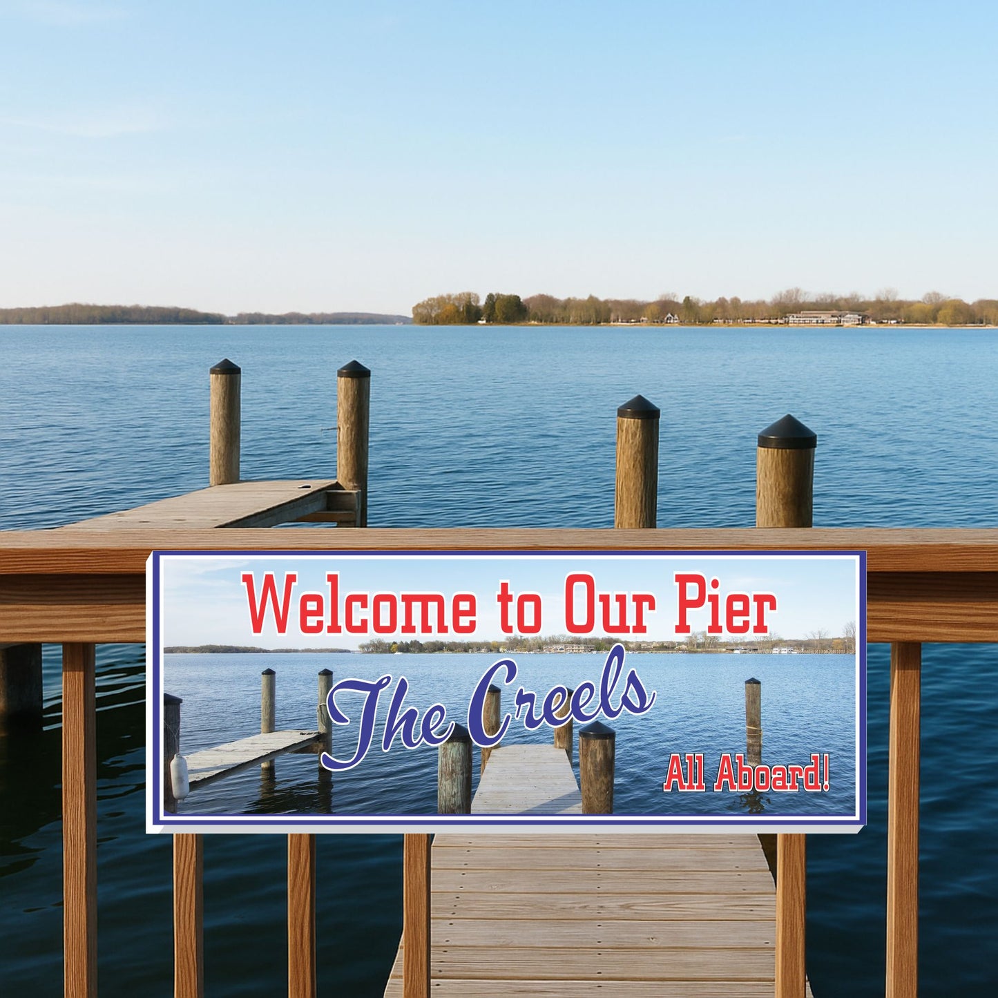 Custom dock or pier sign mounted on a railing above the lake with personalized family name