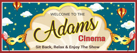Personalized home cinema welcome sign with a starry sky background, clouds, colorful hot air balloons, open clamshell, and masquerade masks. All lines of text are editable for a custom retro look.