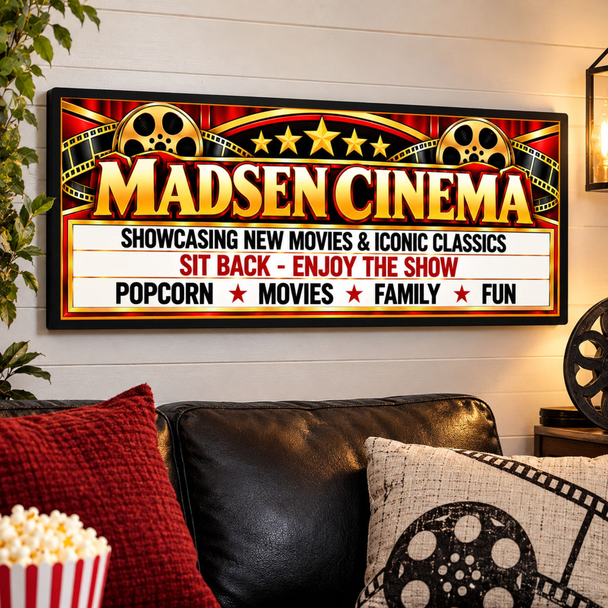 Personalized cinema marquee sign displayed on a home theater wall above seating with movie-themed decor.
