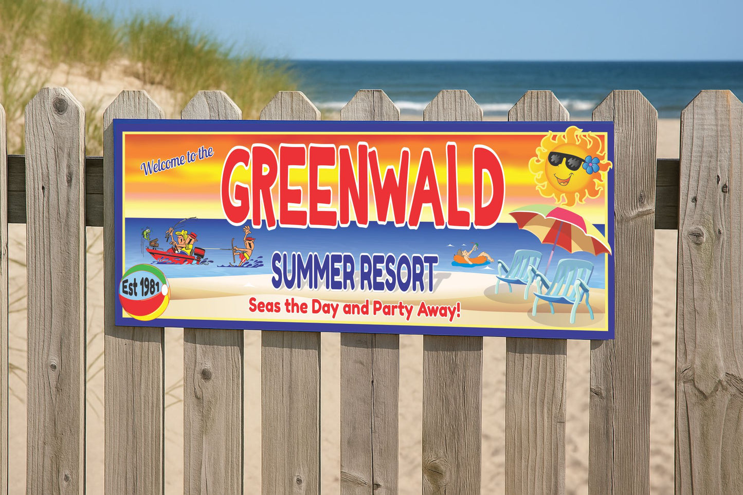 Personalized beach resort sign mounted on an outdoor fence by the dunes
