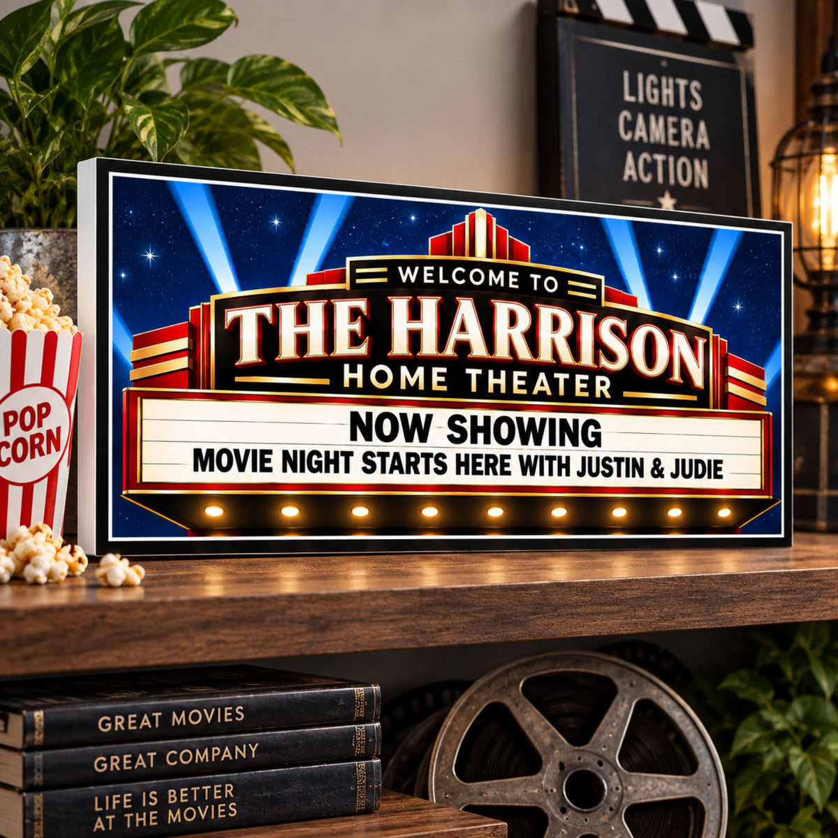 Personalized home theater sign displayed on a shelf with popcorn, greenery and movie decor.