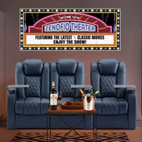 home theater room with recliners and a personalized marquee style sign on the wall