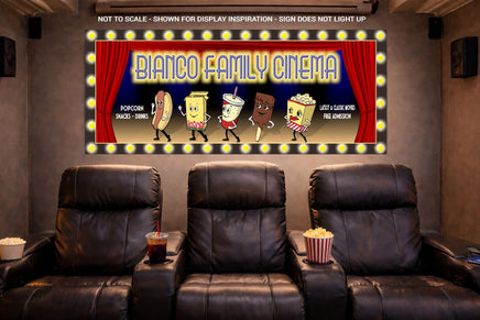 Custom home cinema sign mounted above leather theater seats in a movie room