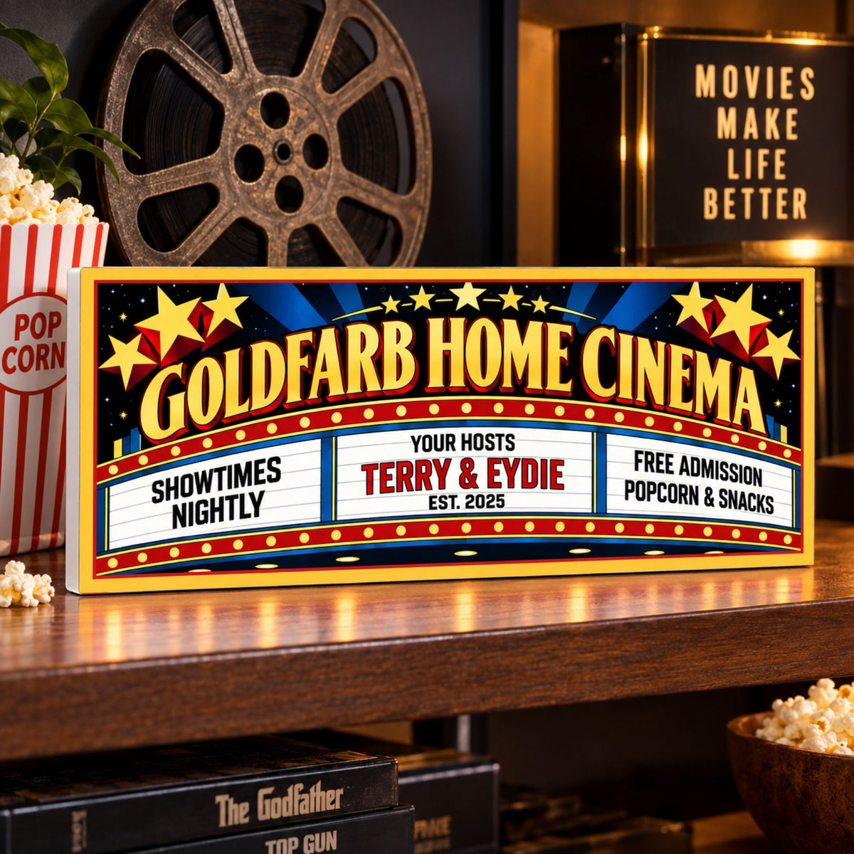 Custom home cinema sign displayed on a shelf with movie theater décor.