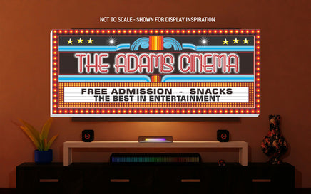 personalized home theater sign mounted above media console 