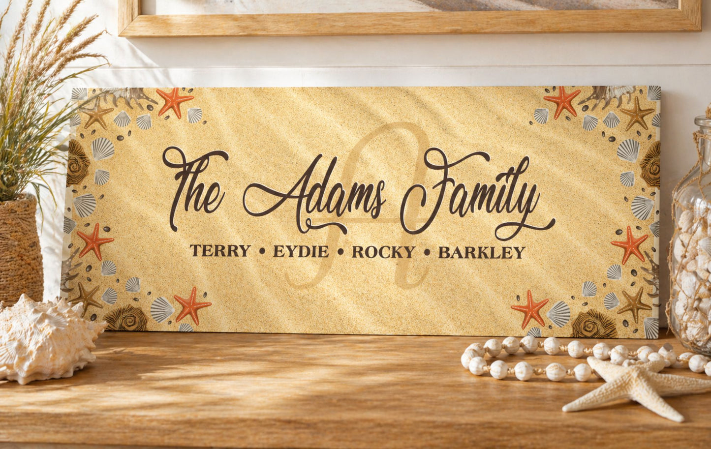 coastal family name sign displayed on wood shelf with beach decor shells and neutral tones