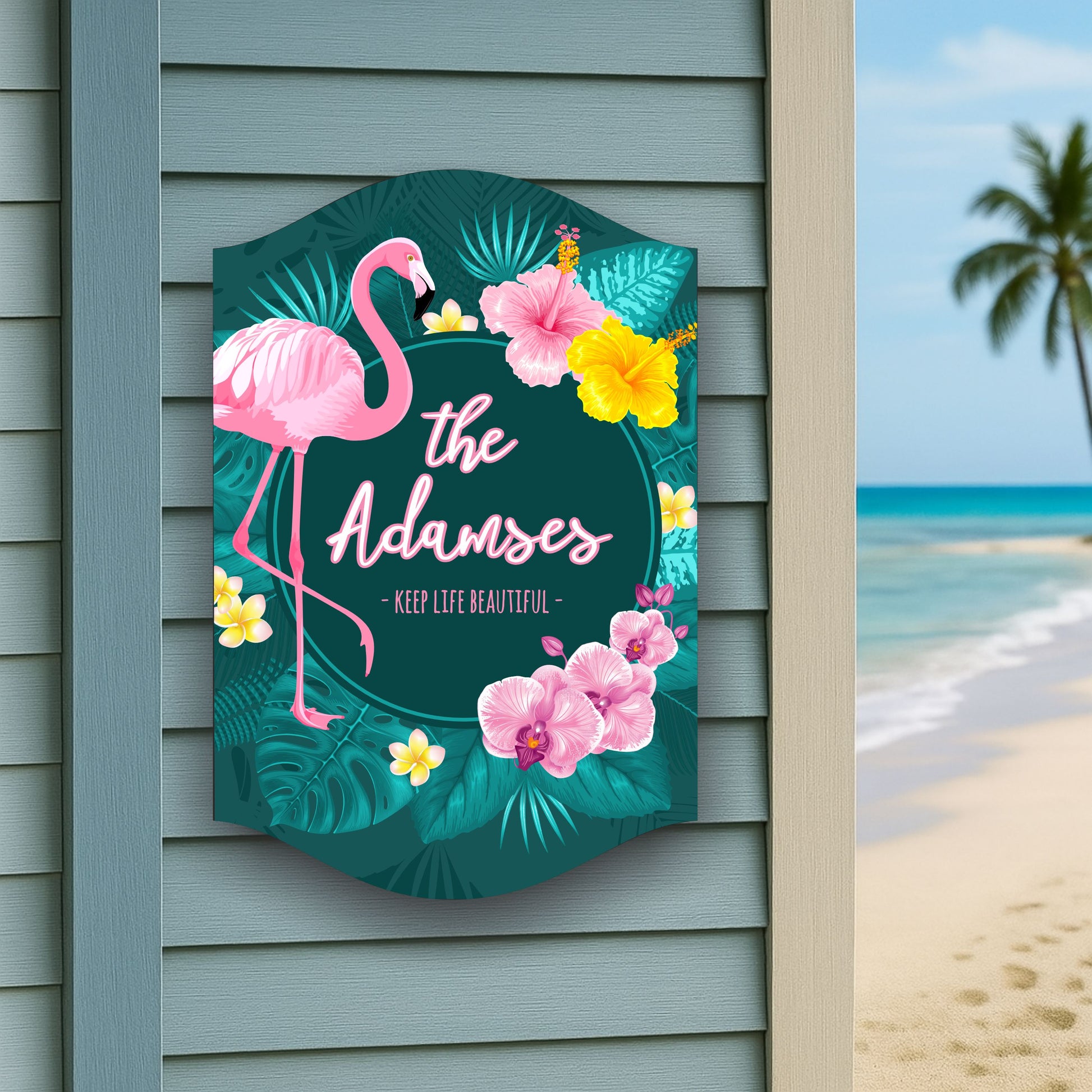 Flamingo tropical family name sign displayed on exterior wall near beach