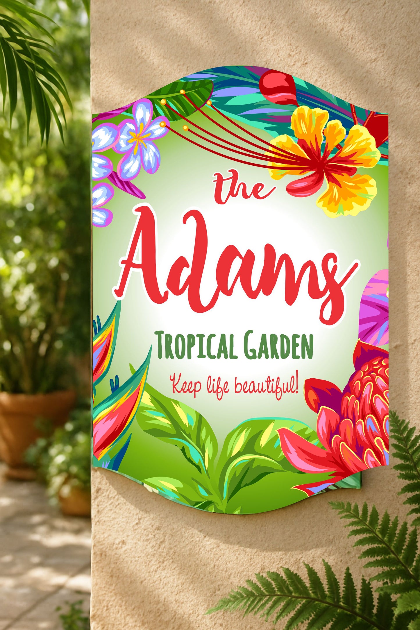 Tropical floral family name sign displayed in outdoor garden setting