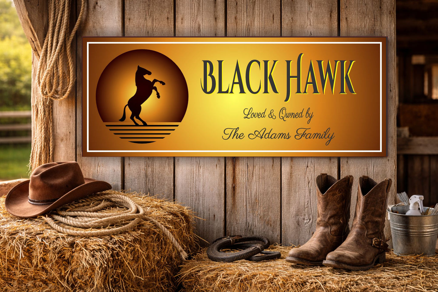 Personalized ranch sign hanging on barn wall with cowboy boots and rope decor