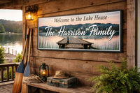 Lake house welcome sign displayed on a rustic cabin wall overlooking the lake