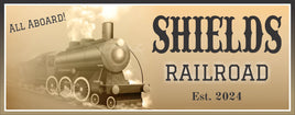Antique-style railroad sign featuring a sepia-toned steam locomotive with customizable text