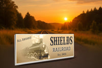 Rustic train sign with vintage steam engine displayed in a man cave or garage setting
