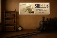 Rustic train sign with vintage steam engine displayed in a man cave or garage setting