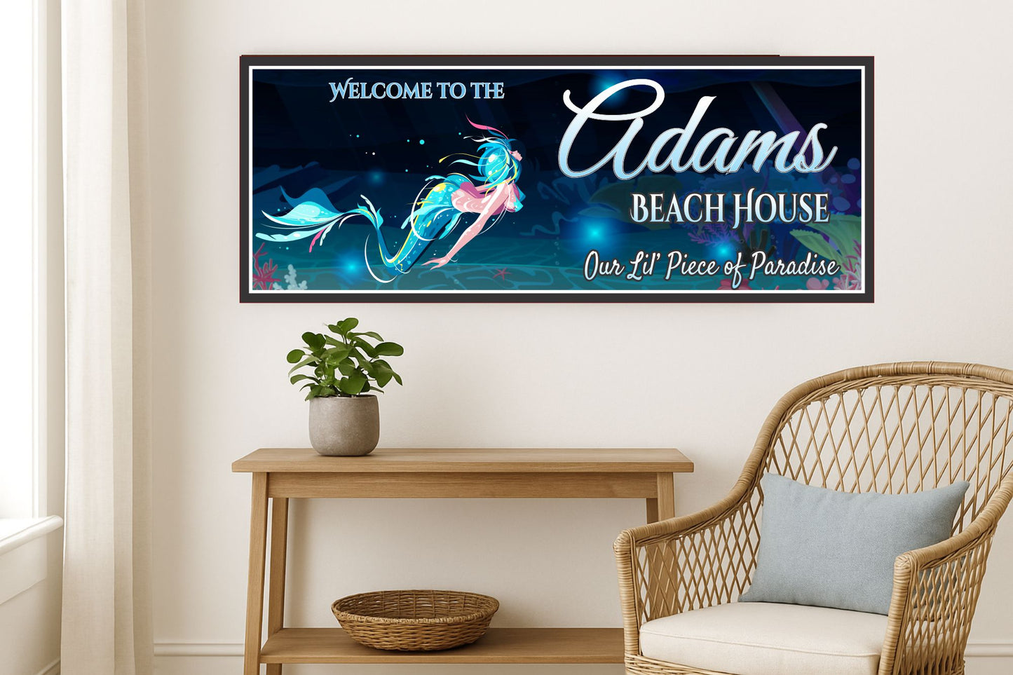 coastal entryway with wicker chair and console table featuring a mermaid beach house sign on the wall