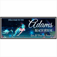 Personalized mermaid beach house sign with underwater ocean artwork, illustrated mermaid, coral and sea life, editable family name and text, printed vinyl mounted on rigid PVC