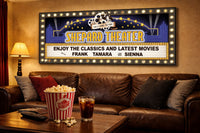 personalized home theater marquee sign hanging above sofa with popcorn and drinks in cozy movie room