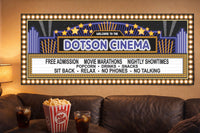 personalized home theater marquee sign hanging above sofa with popcorn and drinks in movie room