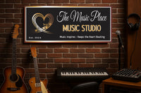 Music studio setup with guitars, keyboard, and 'The Music Place' sign on a brick wall.