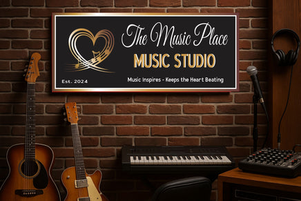 Music studio setup with guitars, keyboard, and 'The Music Place' sign on a brick wall.