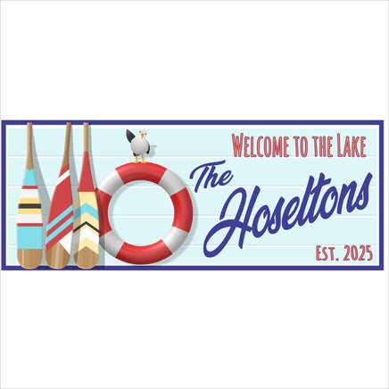 Personalized lake house sign with colorful oars, life preserver, seagull, and family name, reading Welcome to the Lake