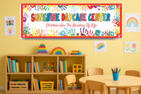Daycare wall sign with rainbow handprints displayed in a childcare space, personalized wording for classroom or playroom decor
