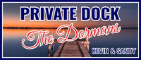 Personalized private dock sign with bold navy lettering and script message over a peaceful lake background, customizable for family name or wording