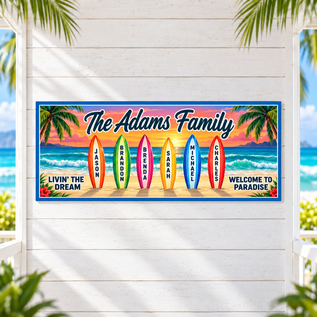 Personalized family beach sign centered on a whitewashed seaside cabana wall, framed by palm leaves and views of the ocean.