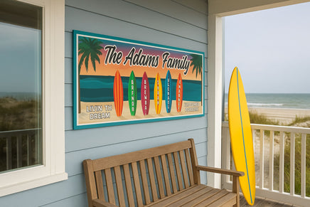 personalized beach family surfboard sign hanging on beach house porch overlooking the ocean