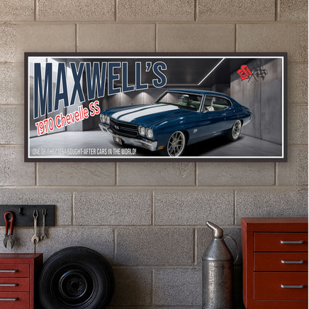 personalized 1970 muscle car garage sign mounted on gray cinder block wall above red tool cabinets, tire, and hanging tools in garage setting