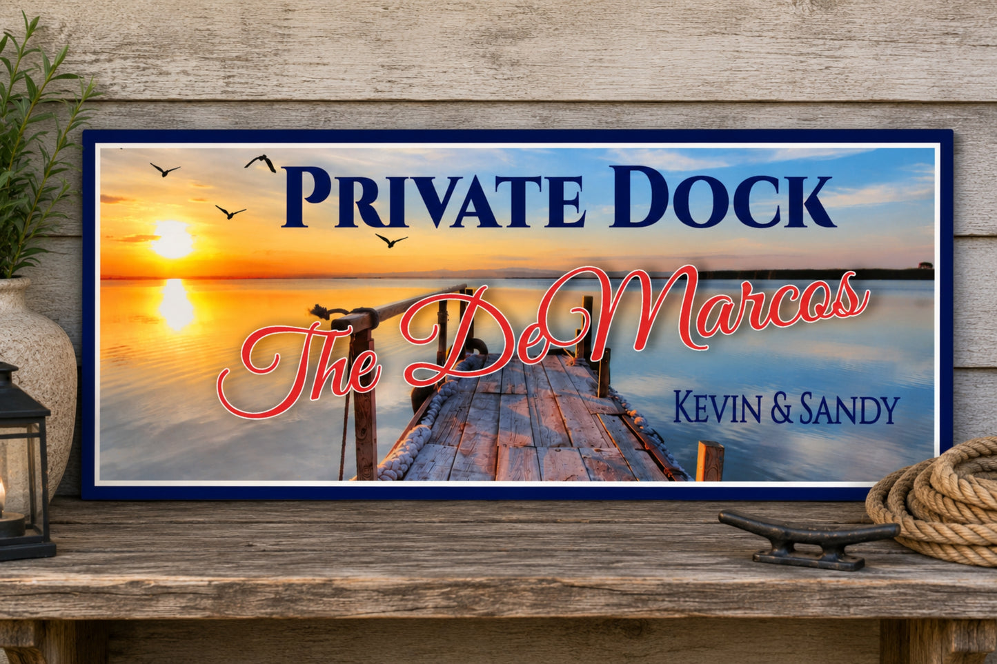 Personalized private dock sign displayed on an outdoor rustic shelf beside nautical rope and lantern decor