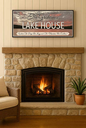 lake house sign with sunset background hanging above a stone fireplace in a cozy living room