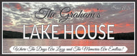 close-up of personalized lake house sign showing sunset art and editable text details