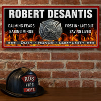 firefighter wall sign displayed on a brick wall with a vintage fire helmet beneath it