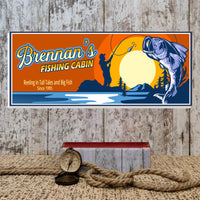 Custom fishing cabin sign displayed in a rustic lodge or cabin wall