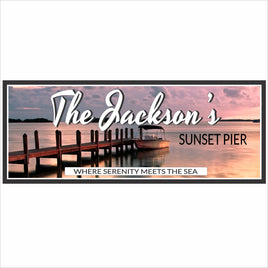 Personalized sunset pier sign featuring a dock and boat with a calm ocean and pastel sky