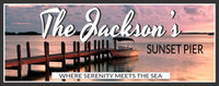Personalized sunset pier sign featuring a dock and boat with a calm ocean and pastel sky
