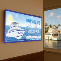 nautical pub sign mounted on an interior wall with a yacht marina visible through the window in the background
