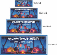 personalized campsite sign available in 18x7, 28x11, 36x15, and 48x20 inches featuring two campers roasting marshmallows by a campfire with tents, trees, and editable text